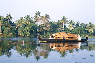 Tourists' rice boat on the backwaters near Kayamkulam, Kerala, India, Asia