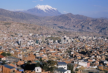 View across city from El Alto, with Illimani volcano in distance, La Paz, Bolivia, South America