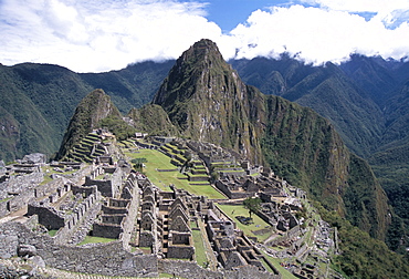 Classic view from Funerary Rock of Inca town site, Machu Picchu, UNESCO World Heritage Site, Peru, South America