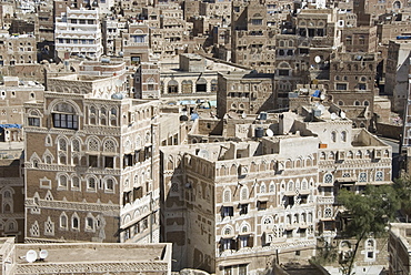 Traditional ornamented brick architecture on tall houses in Old City, Sana'a, UNESCO World Heritage Site, Yemen, Middle East