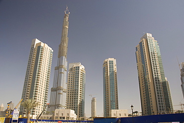 New high rise buildings inland from Jumeirah area, Burj Dubai, world's tallest building under construction in background, Dubai Creek, Dubai, United Arab Emirates, Middle East