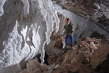 Curved stalactites and wall flowstone of pure salt, in cave in Namakdan salt dome, Qeshm Island, southern Iran, Middle East