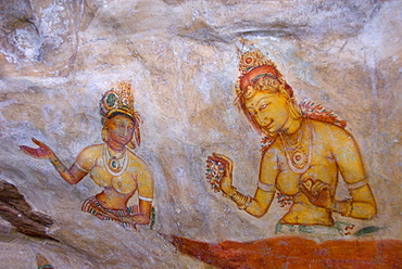 Buddhist frescoes in cave gallery part way up Lion Rock, Sigiriya, UNESCO World Heritage Site, Sri Lanka, Asia