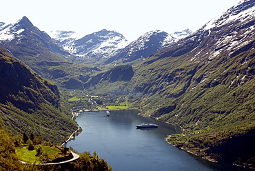 Cruise ships at head of Geiranger Fjord, UNESCO World Heritage Site, with the Dalsnibba snow peaks beyond, seen from the Eagles' Nest viewpoint on the Ornevegen road, west coast, Norway, Scandinavia, Europe