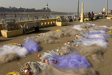 Drying the nets at the fishing harbour on the Daman Ganga River, Daman, Gujarat, India, Asia 