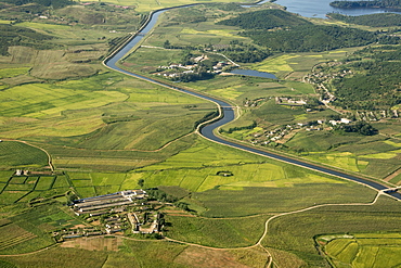 Village, rice paddies and farmland, with large irrigation canal, near Hambong, Hamgyong Province, North Korea, Asia