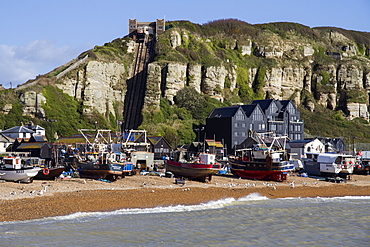 Fishing fleet drawn up on beach and East Hill lift, Hastings, Sussex, England, United Kingdom, Europe