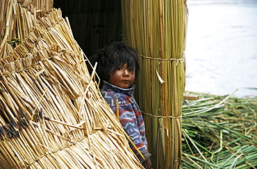 Little boy, Uros floating reed island, Lake Titicaca, Peru, South America