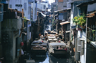 Narrow waterway between houses, Ho Chi Minh City (formerly Saigon), Vietnam, Indochina, Southeast Asia, Asia