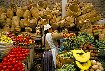 Fruit, vegetables and baskets for sale on stall in market, Sucre, Bolivia, South America