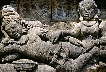 Ancient stone carved panel, Borobudur Temple, UNESCO World Heritage Site, island of Java, Indonesia, Southeast Asia, Asia