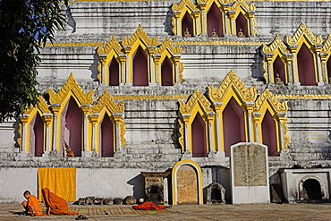 Novice monk sitting on mat writing, Wat Jong Kham, thought to date from the 13th century, Kengtung (Kyaing Tong), Shan State, Myanmar (Burma), Asia