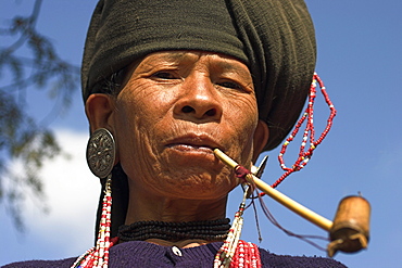 Wan Sai village (Aku tribe), Aku lady smoking wooden pipe, Kengtung (Kyaing Tong), Shan State, Myanmar (Burma), Asia