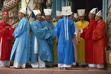 A group of Caodist dignitaries in ceremonial dress at the Cadai Great Temple at Tay Ninh, Halong Bay, Vietnam, Indochina, Southeast Asia, Asia