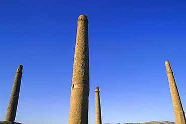 Four of the six remaining minarets marking the corners of the long gone Madrassa built by the last Timurid ruler Sultan Husain Baiquara, within the Mousallah Complex of Gaur Shad's mausoleum, Herat, Afghanistan, Asia