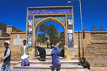 Pilgrims at main entrance arch, Sufi shrine of Gazargah, Herat, Herat Province, Afghanistan, Asia