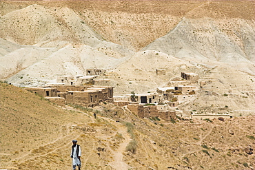 Man walking up mountain road, between Herat and Maimana, after Subzak Pass, Afghanistan, Asia