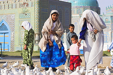 Family looking at the famous white pigeons, Shrine of Hazrat Ali, Mazar-I-Sharif, Afghanistan, Asia