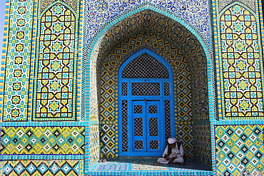 Pilgrim sits in a niche at the Shrine of Hazrat Ali, who was assassinated in 661, Mazar-I-Sharif, Afghanistan, Asia