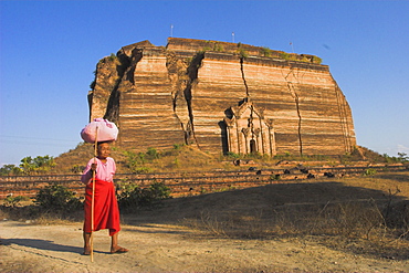 Elderly nun walks past paya with aid of walking stick, Mingun Paya, Mingun, Mandalay, Myanmar (Burma), Asia 