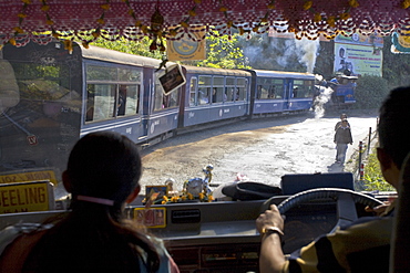 View looking through windscreen of bus at Steam train (Toy Train), Darjeeling, West Bengal, India, Asia