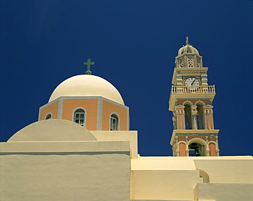 Close-up of a church dome and bell tower with clock, in the village of Oia, Santorini (Thira), Cyclades Islands, Greek Islands, Greece, Europe