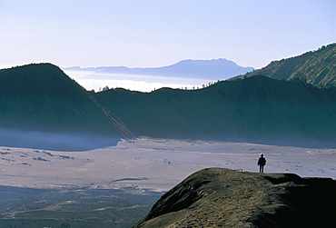 Tourist walking along rim of Gunung Bromo, Bromo-Tengger-Semeru National Park, Java, Indonesia, Southeast Asia, Asia