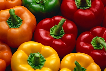 Close-up of yellow, red, orange and green peppers