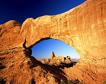 Turret Arch through North Window at sunrise, Arches National Park, Moab, Utah, United States of America (U.S.A.), North America