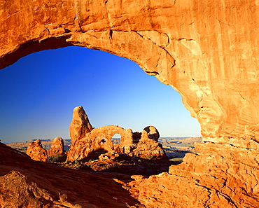 Turret Arch through North Window at sunrise, Arches National Park, Moab, Utah, United States of America, North America