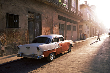Early morning street scene with classic American car, Havana, Cuba, West Indies, Central America