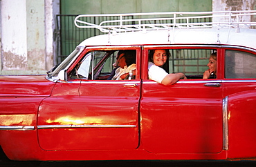 Women waiting in taxi in the early morning, Havana, Cuba, West Indies, Central America