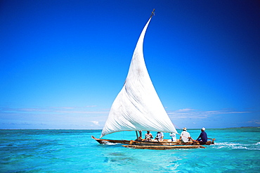 Outrigger canoe with sail on Indian Ocean, off Jambiani, Zanzibar, Tanzania, East Africa, Africa