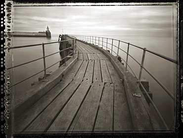 Pinhole camera image of view along timber walkway of Blyth Pier towards lighthouse, Blyth, Northumberland, England, United Kingdom, Europe