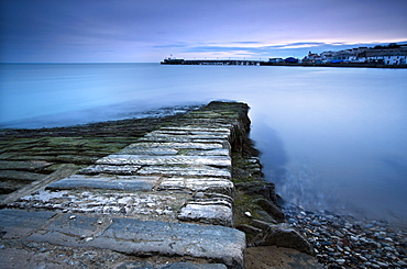 Stone jetty and new pier at dawn, Swanage, Dorset, England, United Kingdom, Europe