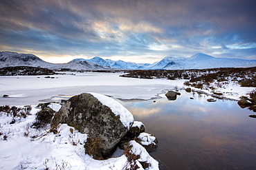 Winter view across Lochain na h'achlaise to the Black Mount hills at dusk, Rannoch Moor, Highland, Scotland, United Kingdom, Europe