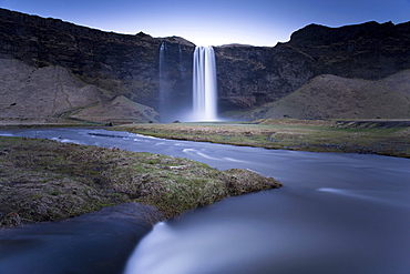 Seljalandsfoss Waterfall captured at dusk using long exposure to record movement in the water, near Hella, southern area, Iceland, Polar Regions