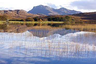 Loch Nan Dailthean with reflections and Beinn Airigh Charr rising in background, near Tournaig, Wester Ross, Highlands, Scotland, United Kingdom, Europe