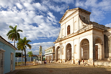 View across Plaza Mayor towards Iglesia de la Santisima Trinidad, the Museo Romantico and the tower of Iglesia y Convento de San Francisco, Trinidad, UNESCO World Heritage Site, Cuba, West Indies, Central America