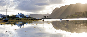 Early morning view of Loch Carron with reflections and sunlight over distant hills, Highlands, Scotland, United Kingdom, Europe