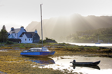 Early morning view of Loch Carron with sunlight bursting over distant hills, Plockton, Kintail, Highlands, Scotland, Europe