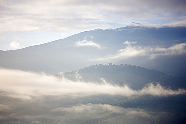 Early morning mist hanging over mountains outside Thimpu, Bhutan, Himalayas, Asia