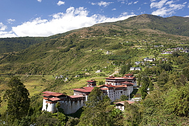 Trongsa Dzong set among tree-covered hills near the town of Trongsa, Bhutan, Asia