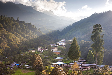 Village of Chendebji set among forested hills between the towns of Wangdue Phodrang and Trongsa, Bhutan, Himalayas, Asia