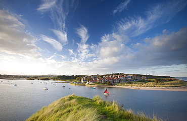 Alnmouth village and the Aln Estuary viewed from Church Hill on a calm late summer's evening with a dramatic sky overhead, Alnmouth near Alnwick, Northumberland, England, United Kingdom, Europe