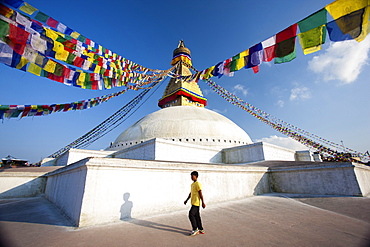 Bodhnath Stupa (Boudhanth) (Boudha) one of the holiest Buddhist sites in Kathmandu, UNESCO World Heritage Site, with colourful prayer flags captured against clear blue sky, Kathmandu, Nepal, Asia