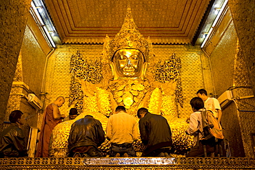 Myanmar's most famous Buddha image, 13ft high and covered in 6 inches of pure gold leaf , Mahamuni Paya, Mandalay, Myanmar (Burma), Southeast Asia