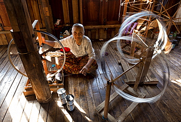 Woman spinning silk in factory in In Phaw Khone village, Inle Lake, Myanmar (Burma), Southeast Asia