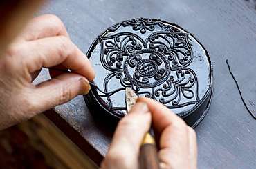 Black Kengtung style lacquerware being made at U Mu Ling Ta, a fifth-generation shop specialising in lacquerware in Kengtung (Kyaingtong), Shan State, Myanmar (Burma), Asia