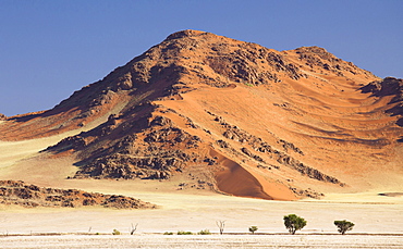 Towering sandstone mountains and dunes in the ancient Namib Desert near Sesriem, Namib Naukluft Park, Namibia, Africa